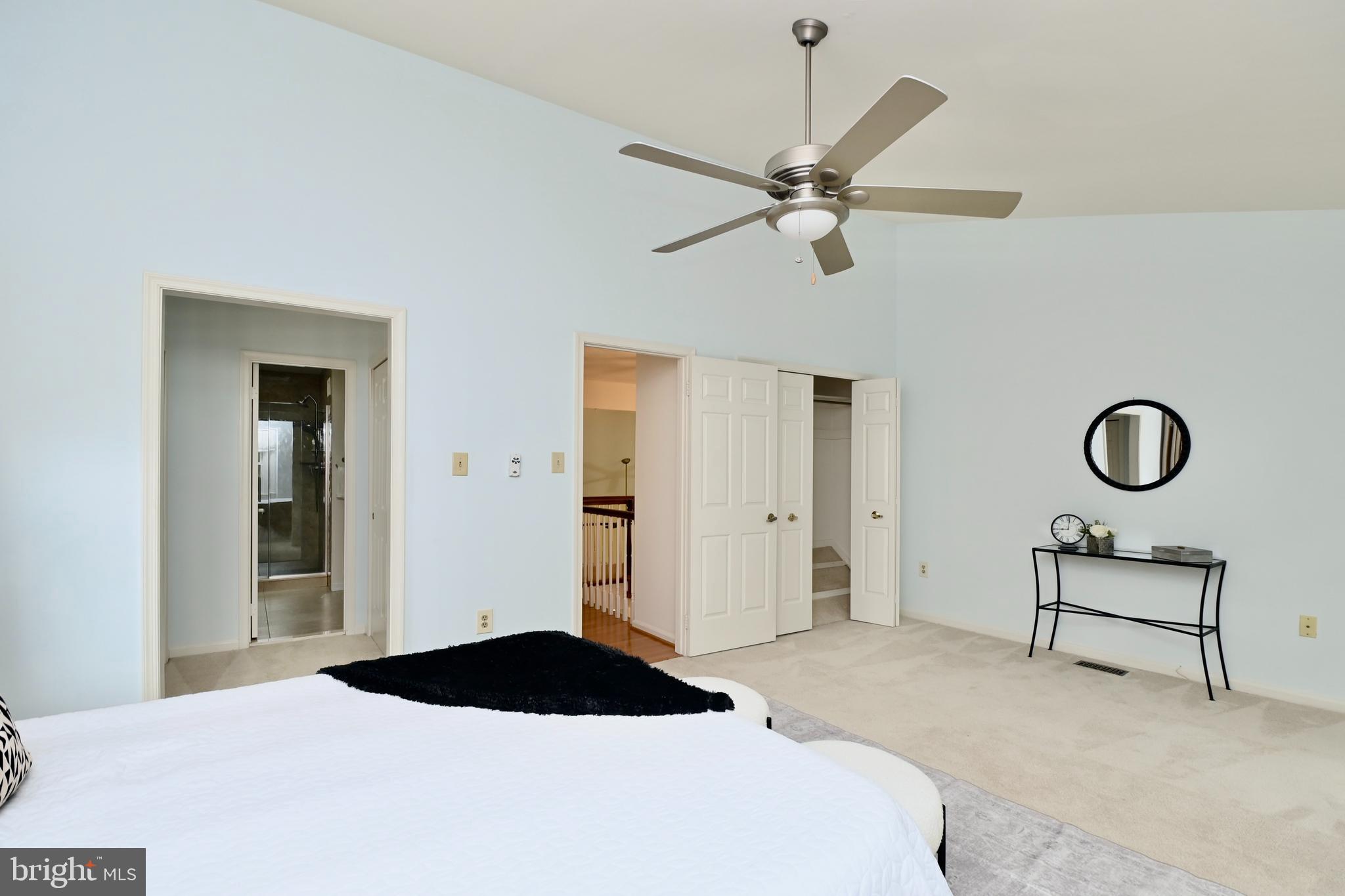 7443 Crestberry Lane Bethesda, MD 20817 - Photo 23 of 46 a bedroom with a bed and a chandelier