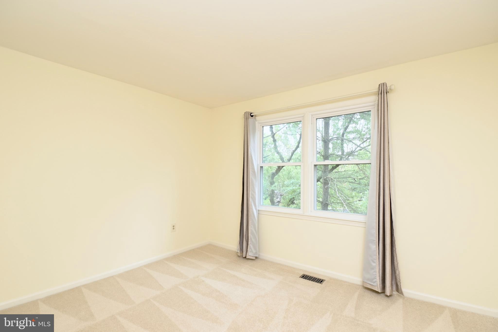 7443 Crestberry Lane Bethesda, MD 20817 - Photo 27 of 46 a view of an empty room and a window