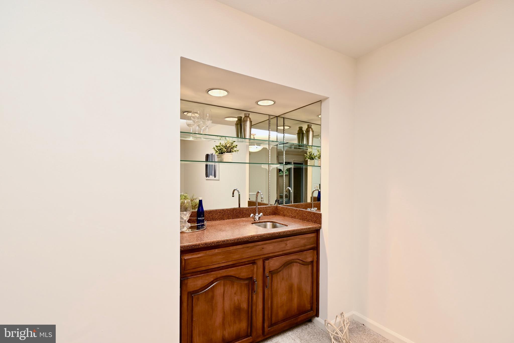 7443 Crestberry Lane Bethesda, MD 20817 - Photo 36 of 46 a room with a sink and cabinets