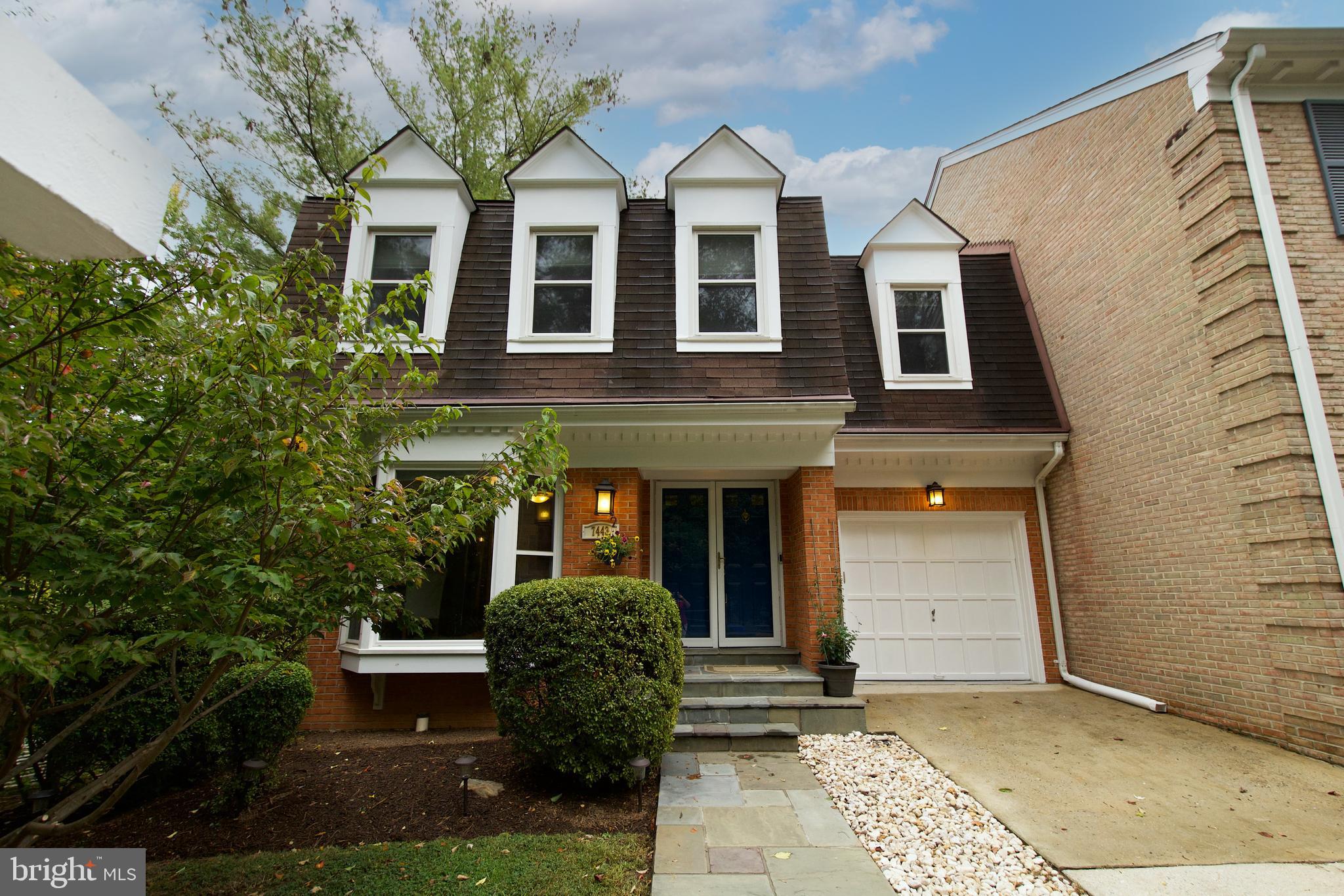 7443 Crestberry Lane Bethesda, MD 20817 - Photo 4 of 46 a front view of a house with garden