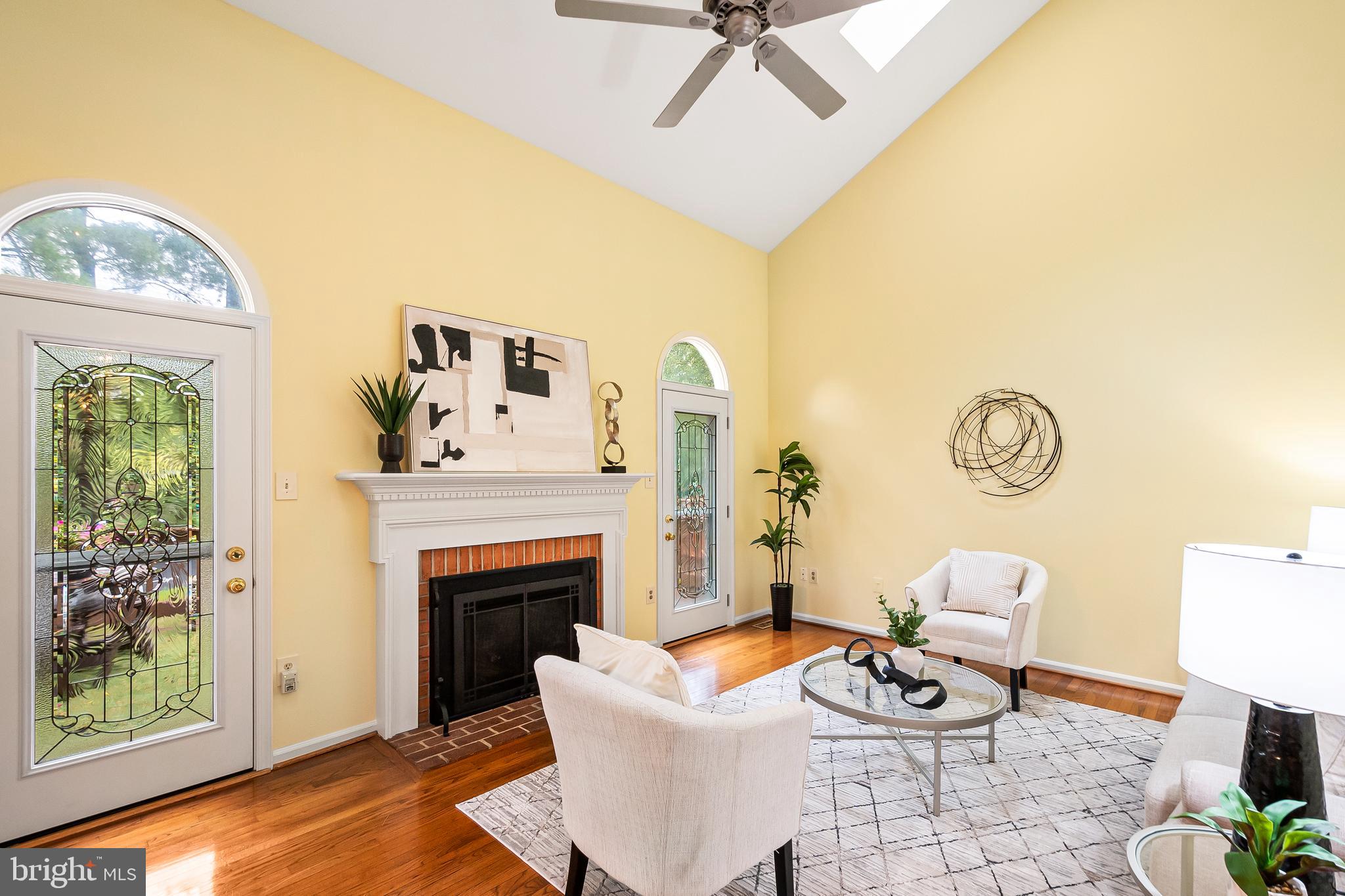 7443 Crestberry Lane Bethesda, MD 20817 - Photo 7 of 46 a living room with furniture and a fireplace