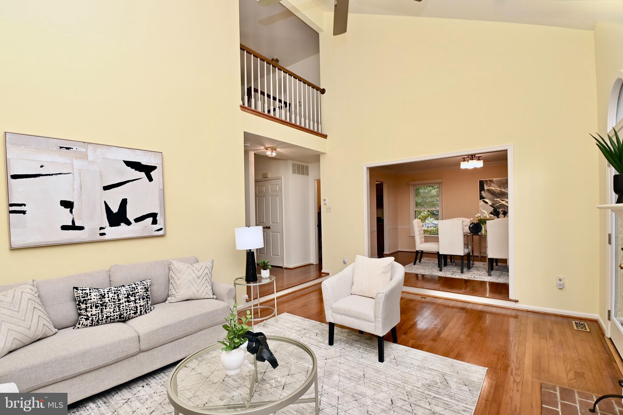 7443 Crestberry Lane Bethesda, MD 20817 - Photo 9 of 46 a living room with furniture and a wooden floor