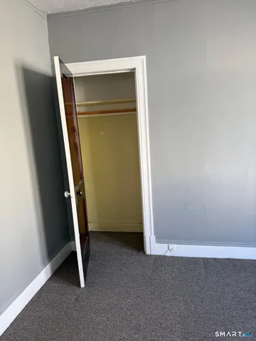 a view of an empty walk in closet