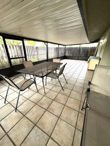 a view of an empty room with a large window