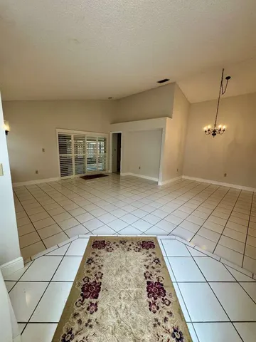 a view of a livingroom with an empty space and a sink