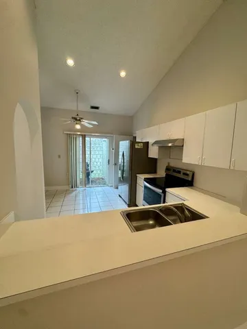 a kitchen with a stove and a refrigerator