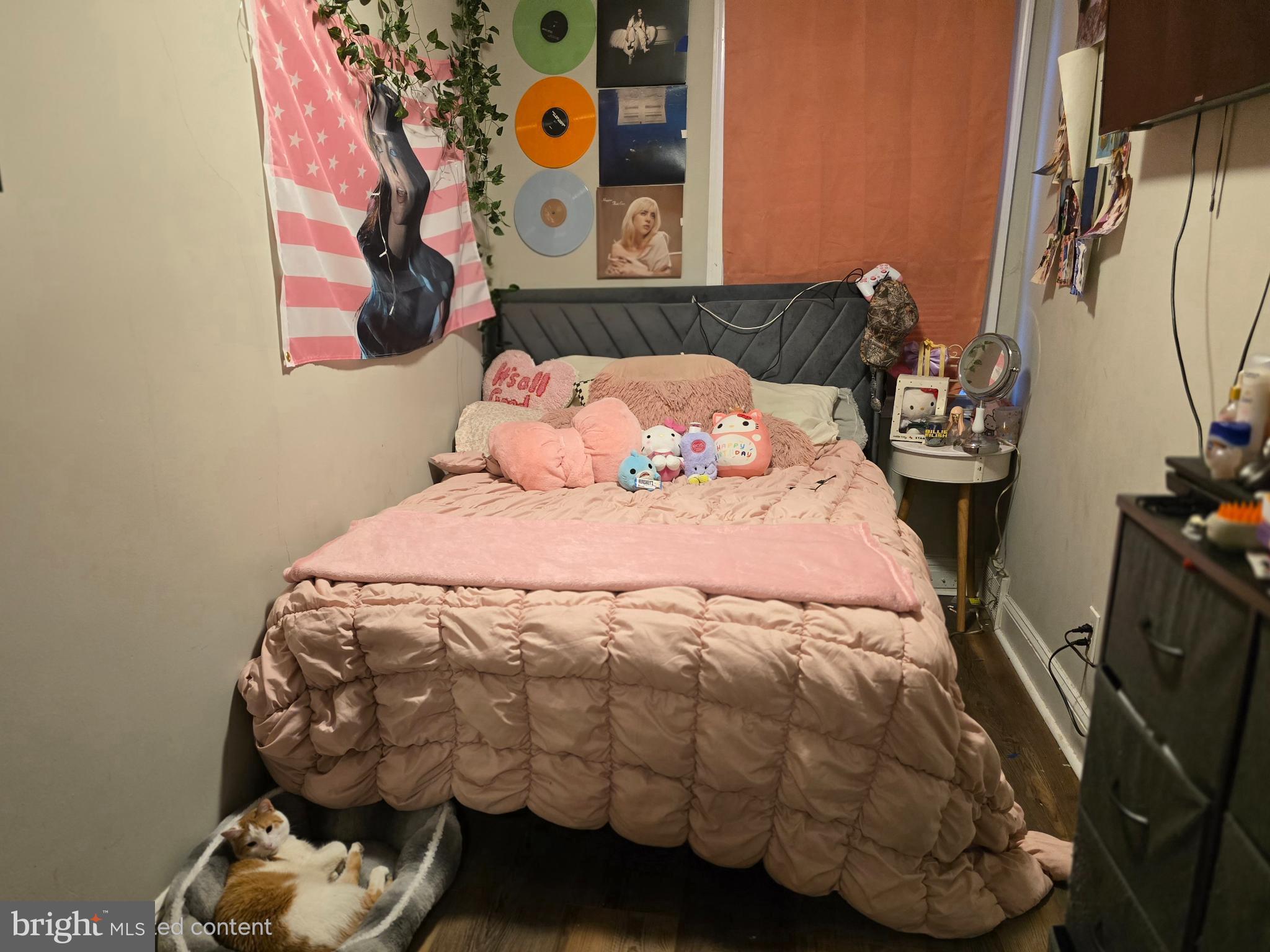 229 West 22nd Street Chester, PA 19013 - Photo 12 of 20 a bed sitting in a bedroom next to a window