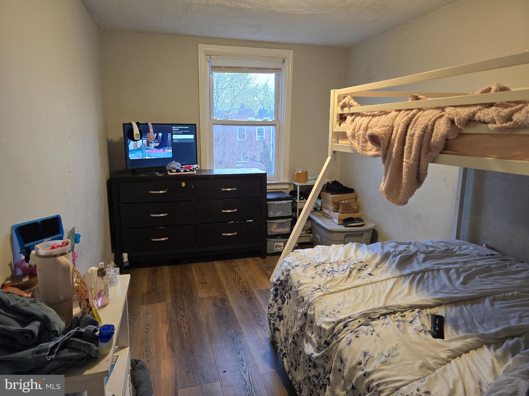 229 West 22nd Street Chester, PA 19013 - Photo 15 of 20 a bed room with a bed and a tv