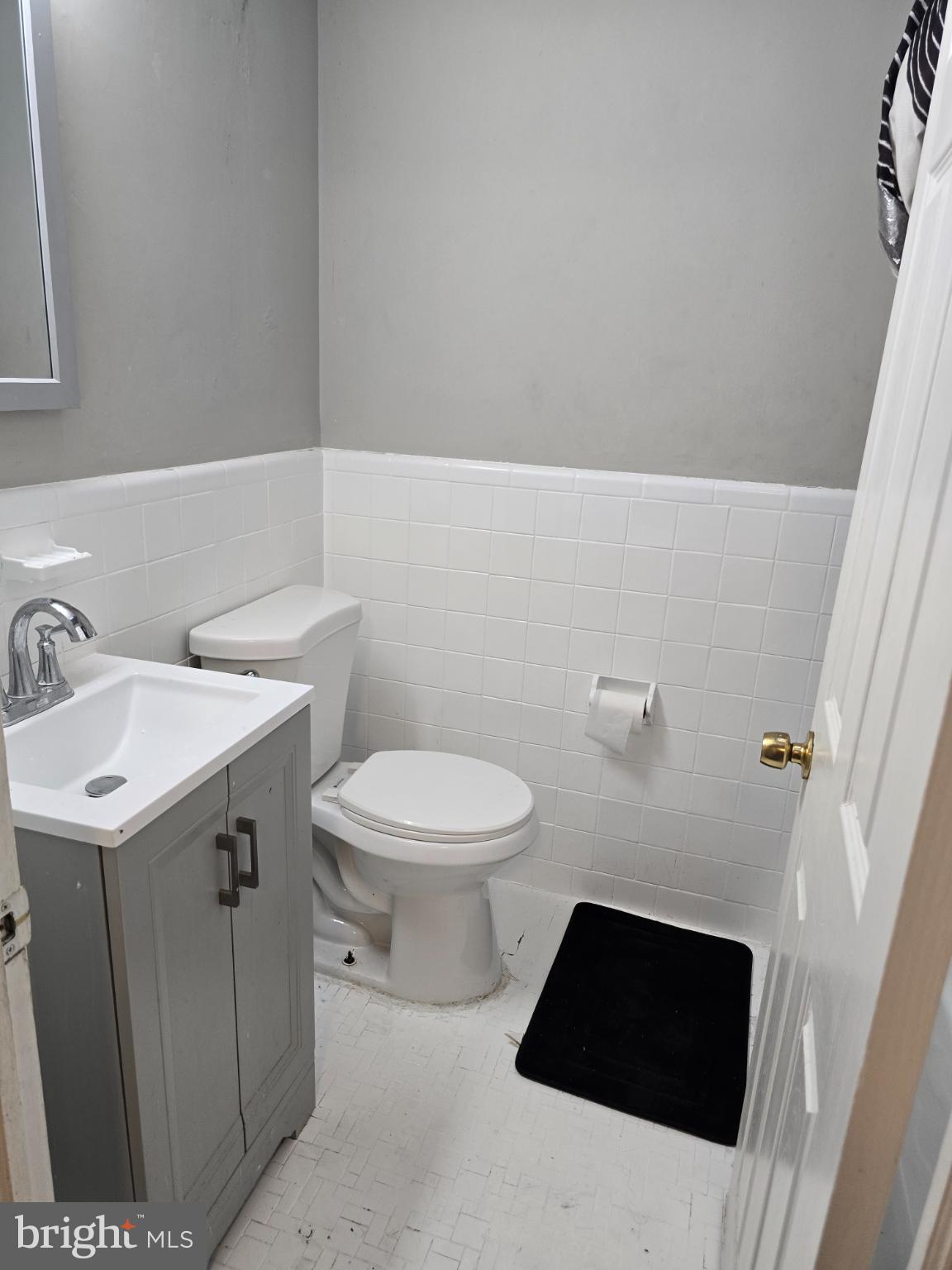 229 West 22nd Street Chester, PA 19013 - Photo 16 of 20 a bathroom with a sink and a toilet