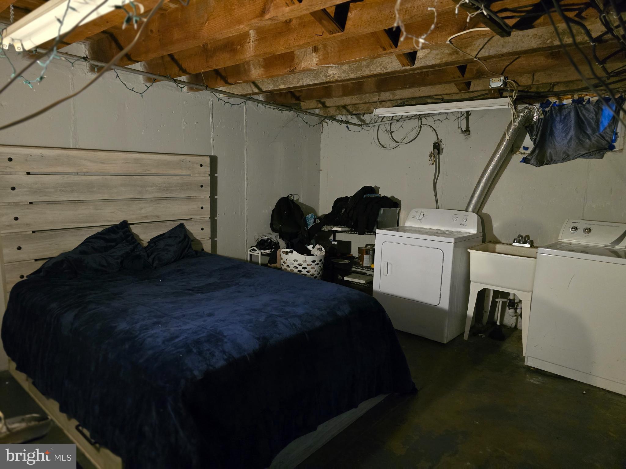 229 West 22nd Street Chester, PA 19013 - Photo 17 of 20 a bed room with a bed and a chair