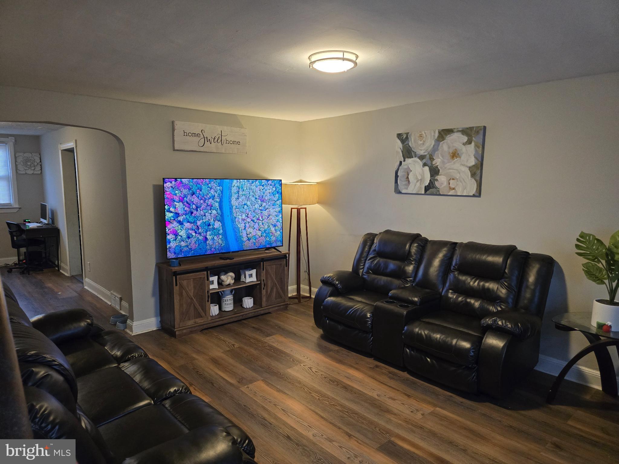 229 West 22nd Street Chester, PA 19013 - Photo 3 of 20 a living room with furniture and a flat screen tv