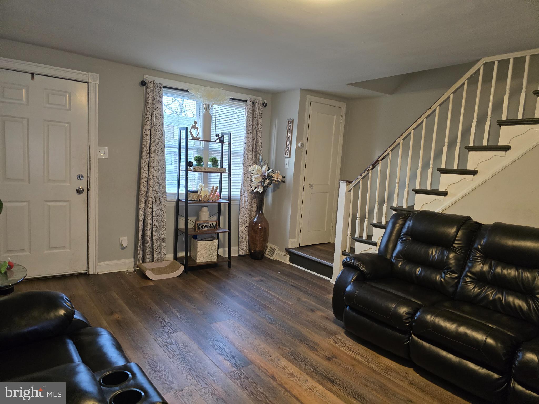 229 West 22nd Street Chester, PA 19013 - Photo 4 of 20 a living room with wooden floor and furniture