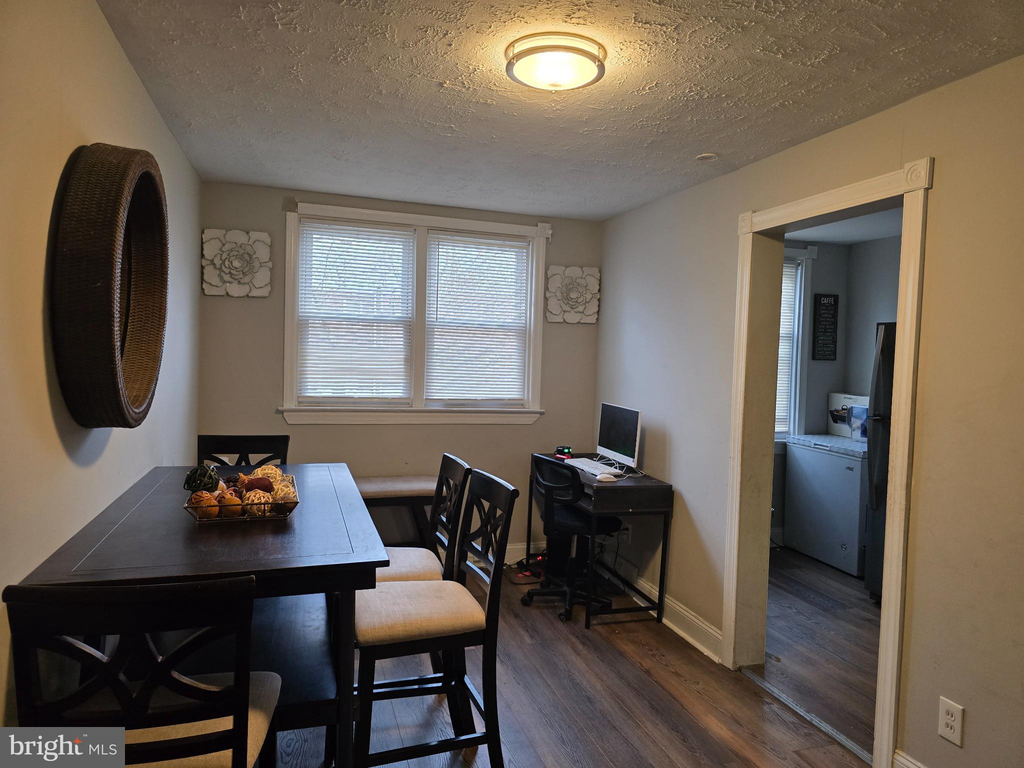 229 West 22nd Street Chester, PA 19013 - Photo 5 of 20 a view of a workspace with furniture and a window
