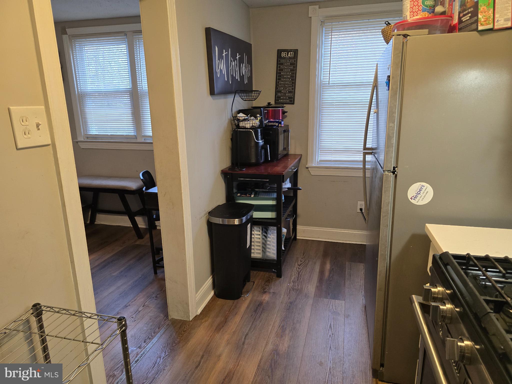229 West 22nd Street Chester, PA 19013 - Photo 8 of 20 a view of a workspace with furniture and wooden floor