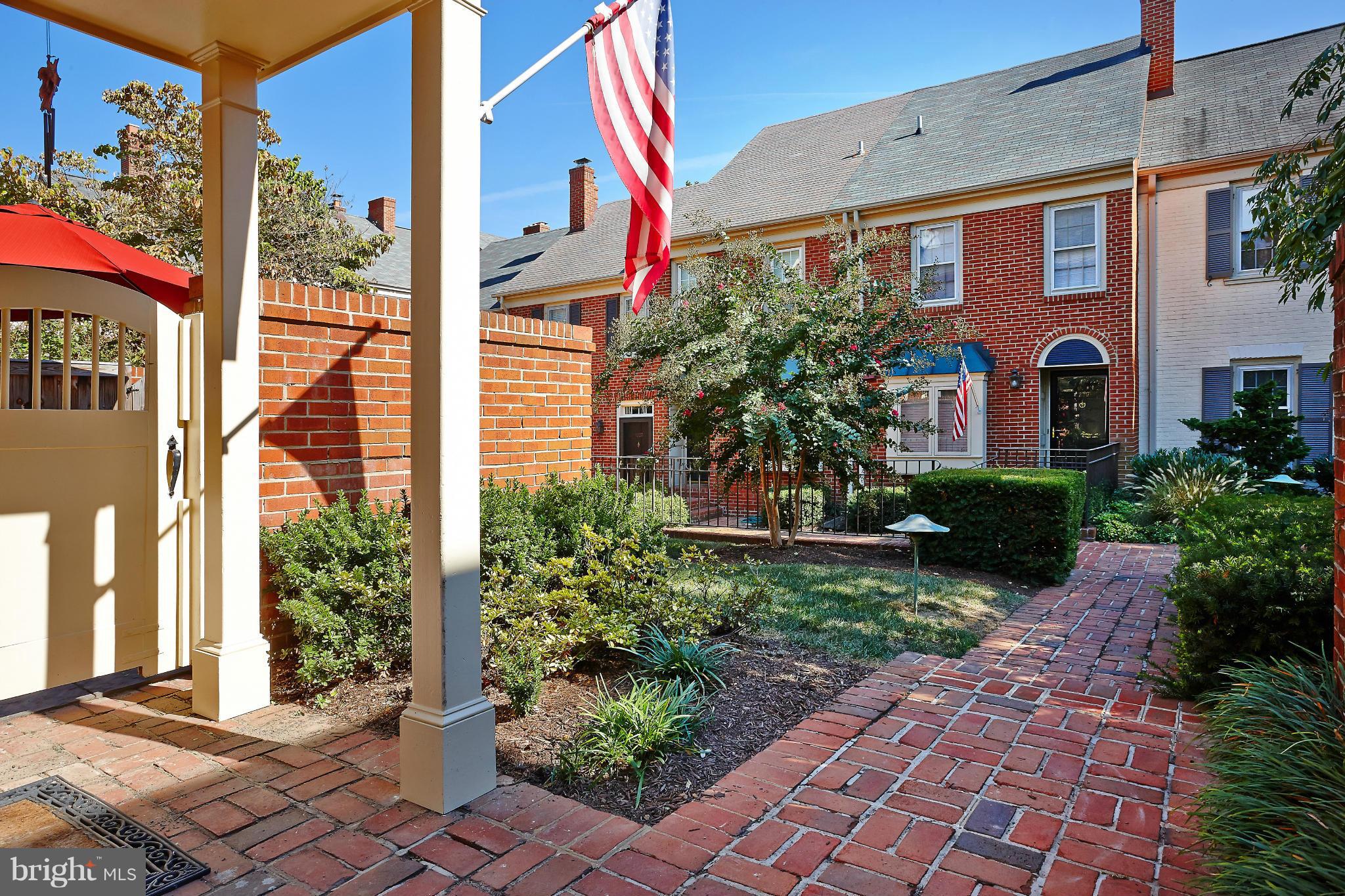 1235 Portner Road Alexandria, VA 22314 - Photo 2 of 25 a front view of a house with a yard