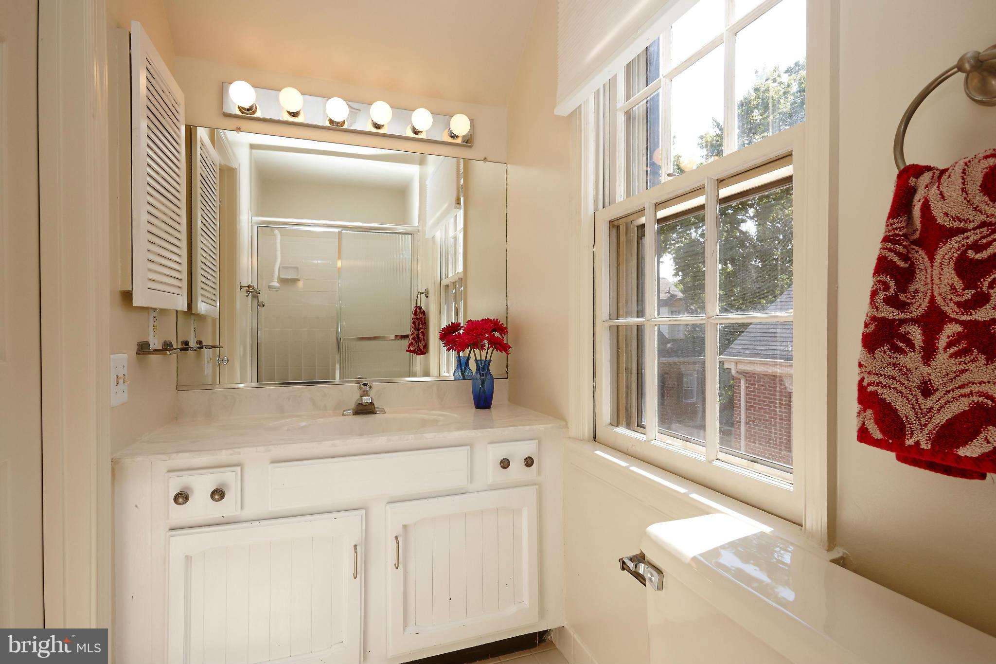 1235 Portner Road Alexandria, VA 22314 - Photo 12 of 25 a bathroom with a sink vanity and a mirror