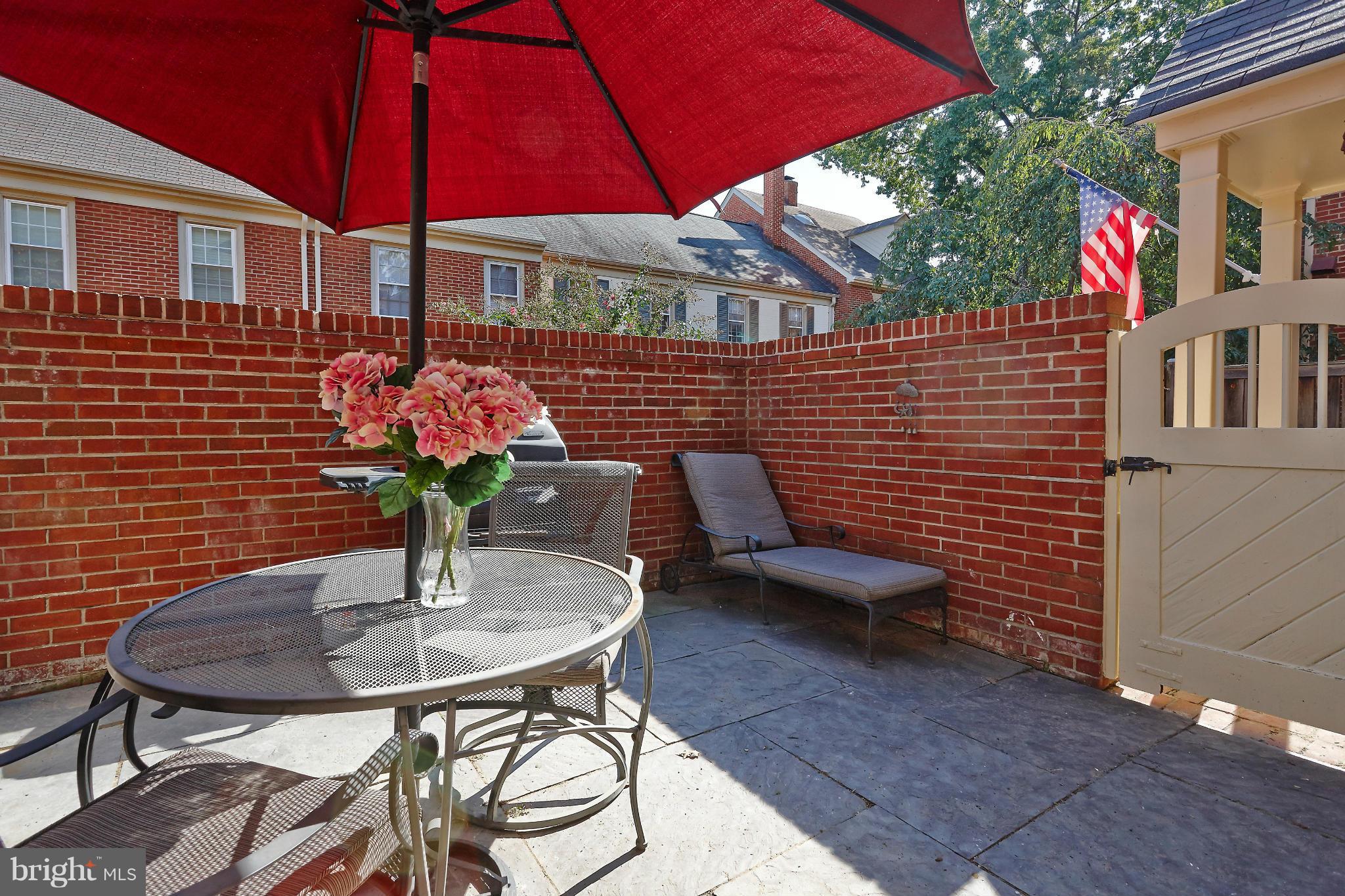1235 Portner Road Alexandria, VA 22314 - Photo 17 of 25 a table and chairs in patio of a house