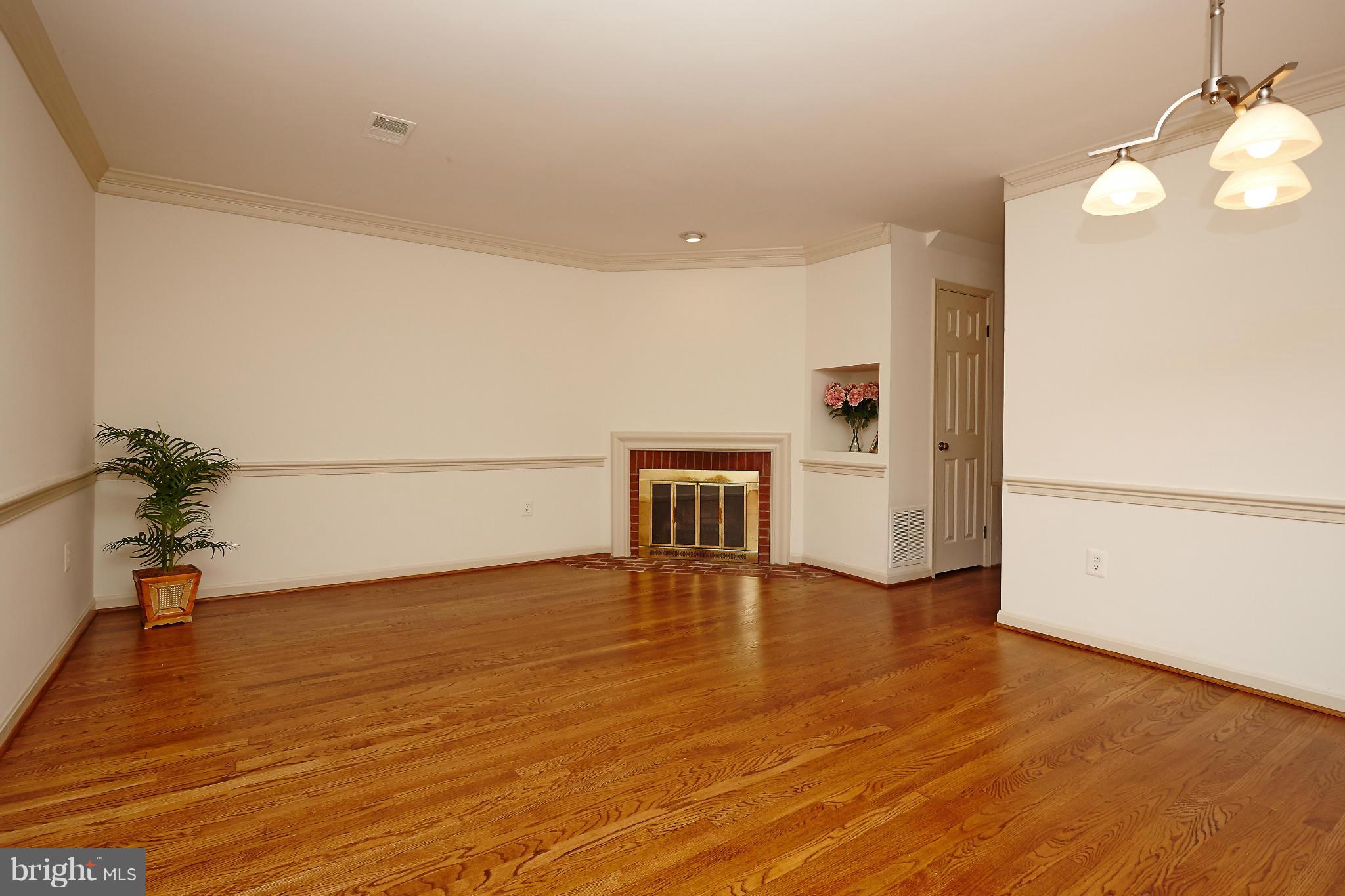 1235 Portner Road Alexandria, VA 22314 - Photo 5 of 25 a view of an empty room with wooden floor