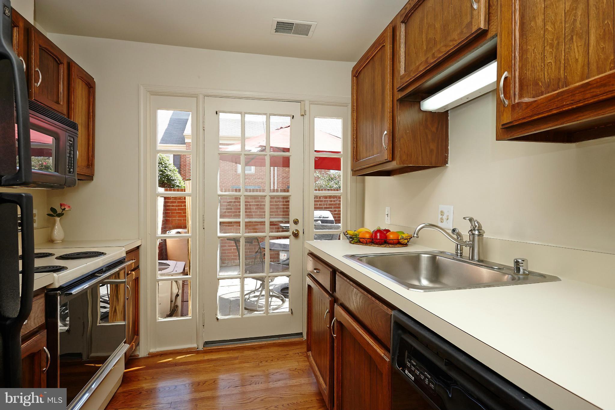 1235 Portner Road Alexandria, VA 22314 - Photo 8 of 25 a kitchen with stainless steel appliances a sink dishwasher stove and refrigerator