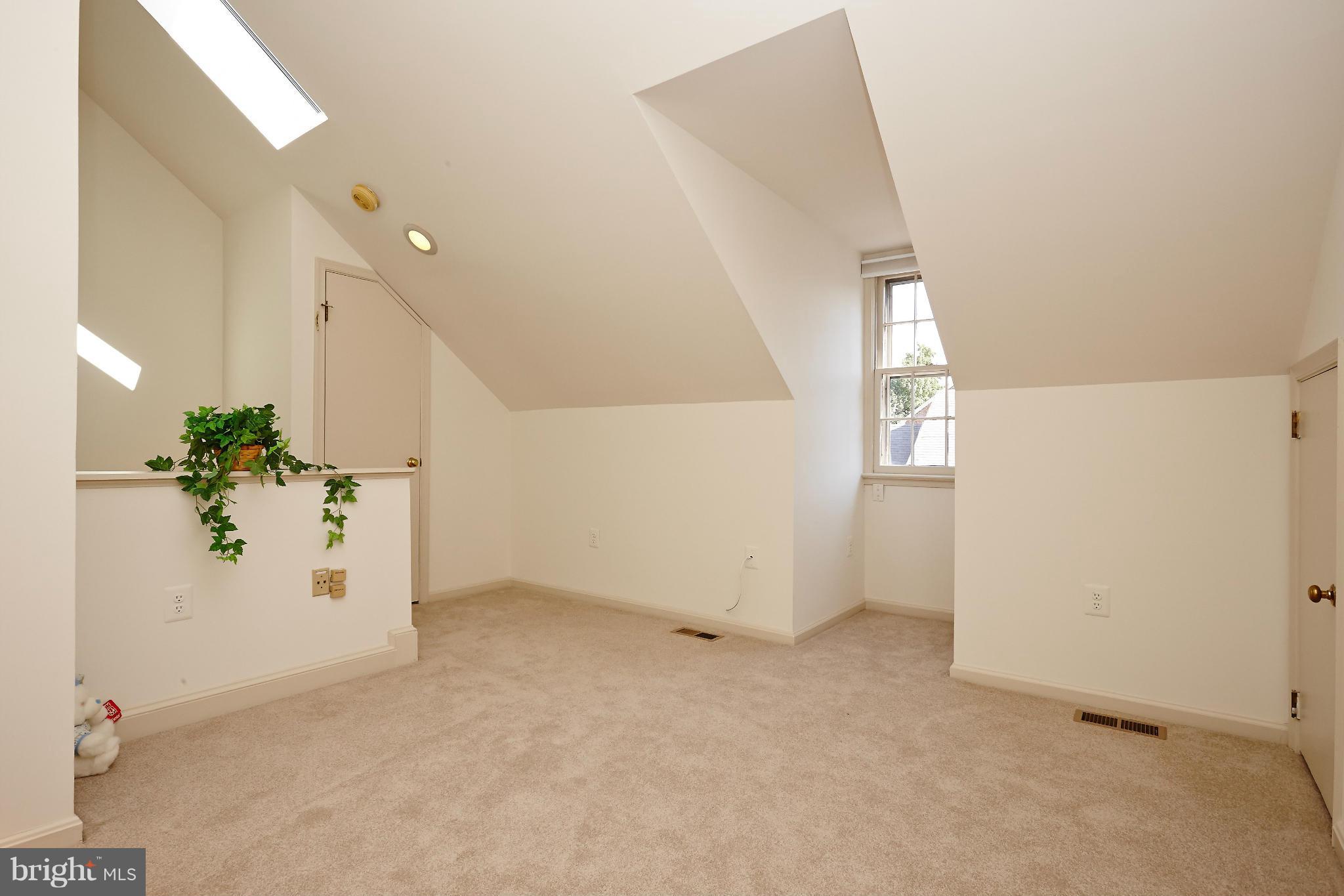 1235 Portner Road Alexandria, VA 22314 - Photo 10 of 25 an empty room with windows and entrance