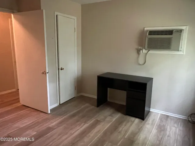 a room with a bench and a mirror