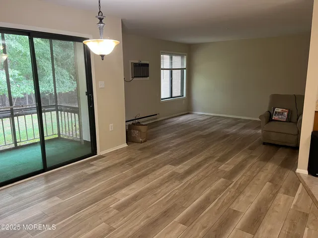 a view of a livingroom with wooden floor