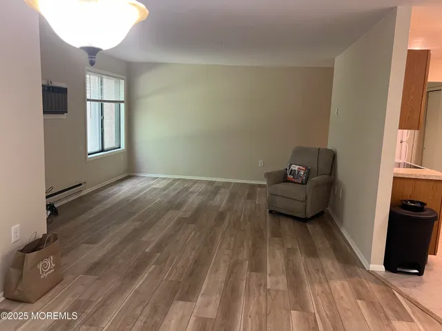 a view of livingroom with furniture and wooden floor