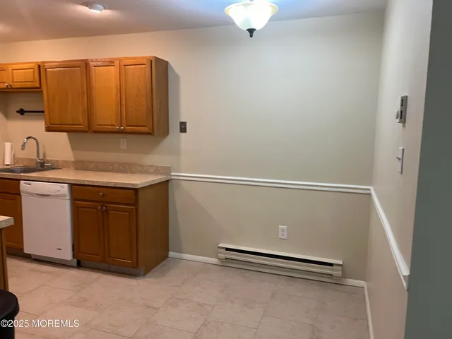 a view of a kitchen with a sink
