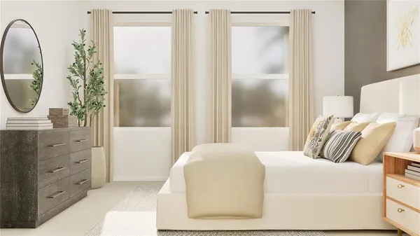 a bedroom with a bed and a mirror