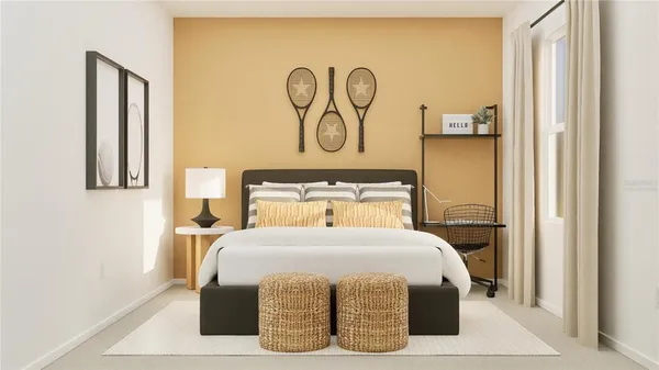 a bedroom with a bed and painting on the wall