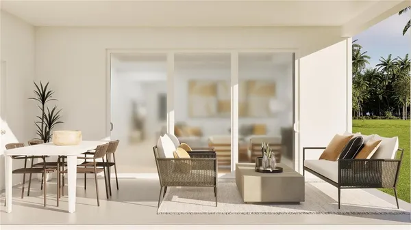 a living room with furniture and a floor to ceiling window