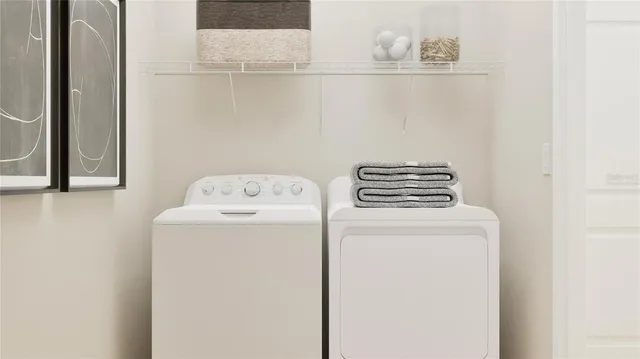 a utility room with dryer and washer