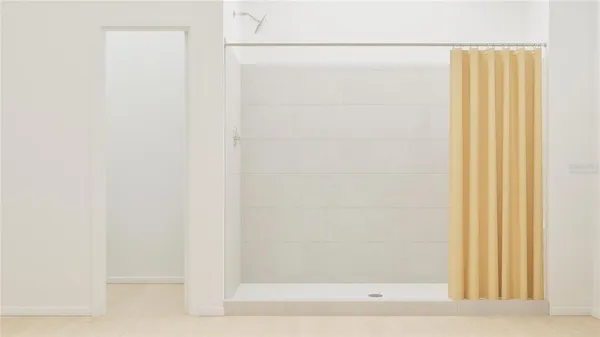 a bathroom with a glass shower door
