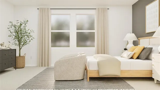 a bedroom with a bed and a potted plant