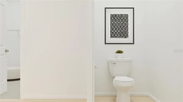 a bathroom with a toilet and a sink