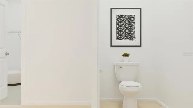 a bathroom with a toilet and a sink