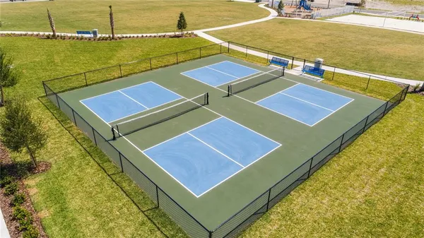 a view of a lake with a yard in front of it