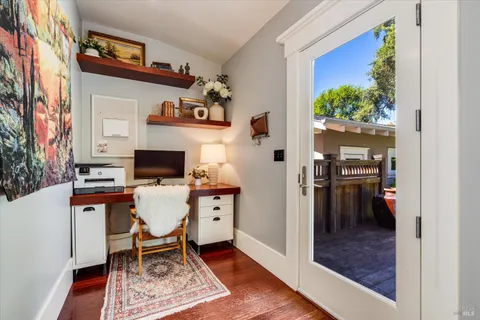 a workspace with furniture and a window