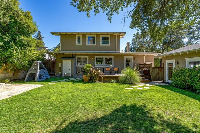 a view of a house with a yard porch and sitting area