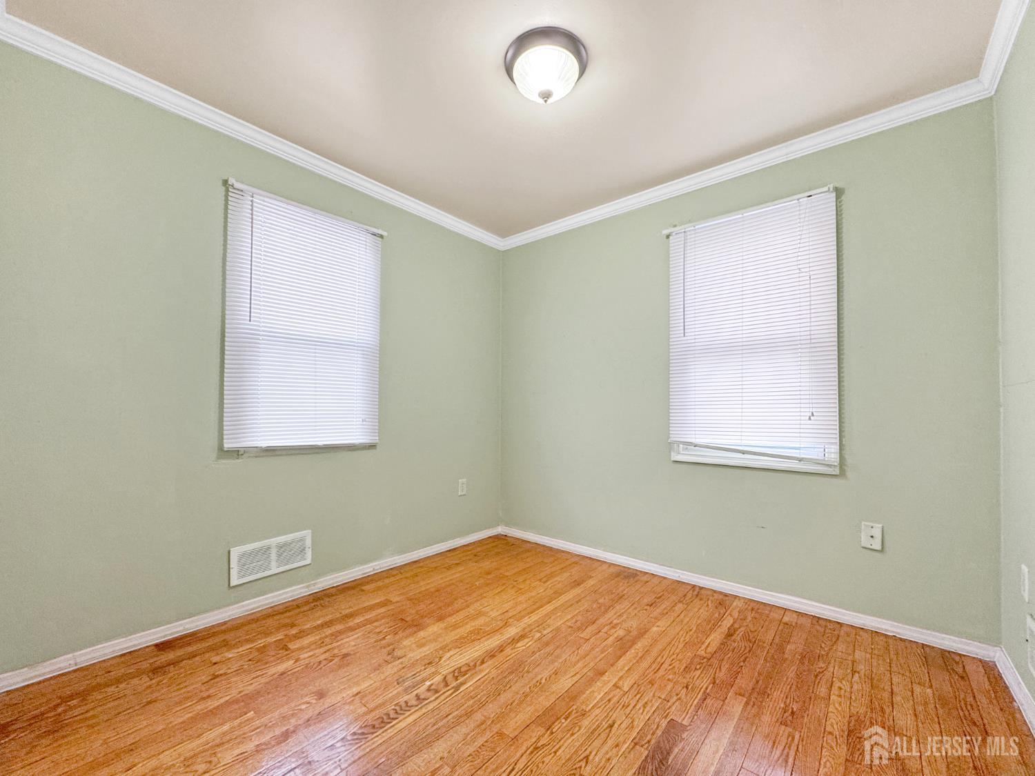 117 Old Post Road Edison, NJ 08817 - Photo 11 of 22 a view of a room with wooden floor and fan