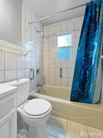 a bathroom with a toilet a sink and bathtub