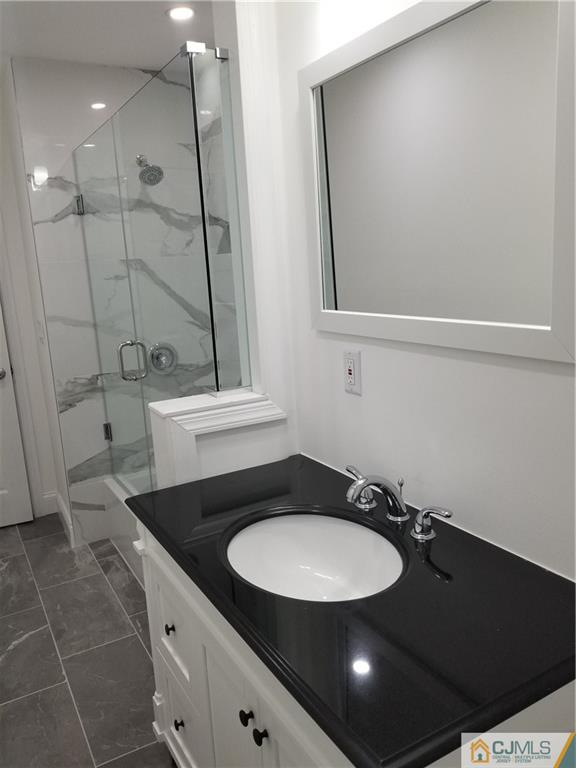 9 Yale Road Old Bridge, NJ 08859 - Photo 13 of 20 a bathroom with a sink and a mirror
