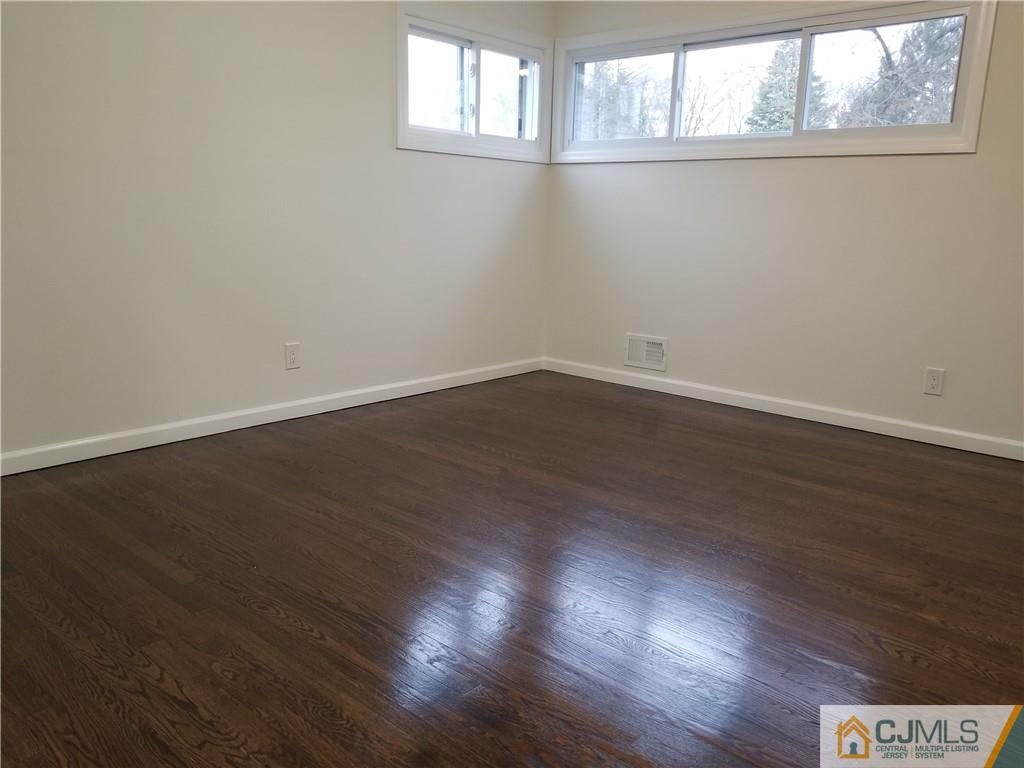 9 Yale Road Old Bridge, NJ 08859 - Photo 16 of 20 an empty room with wooden floor and windows