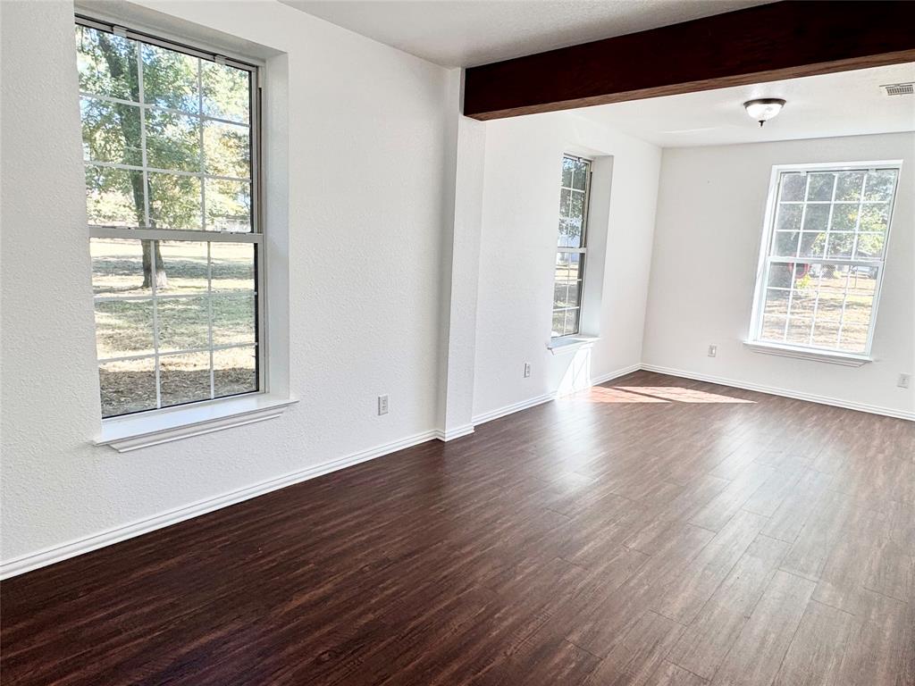 921 Bradleys Bend Tool, TX 75143 - Photo 12 of 29 a view of an empty room with wooden floor and a window