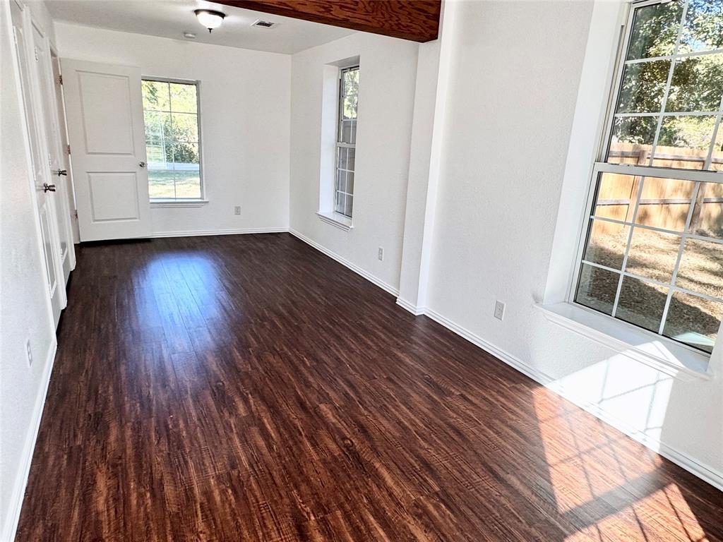 921 Bradleys Bend Tool, TX 75143 - Photo 15 of 29 an empty room with wooden floor and windows