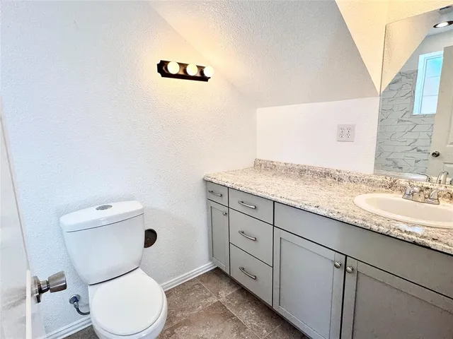 a bathroom with a toilet and a bathtub