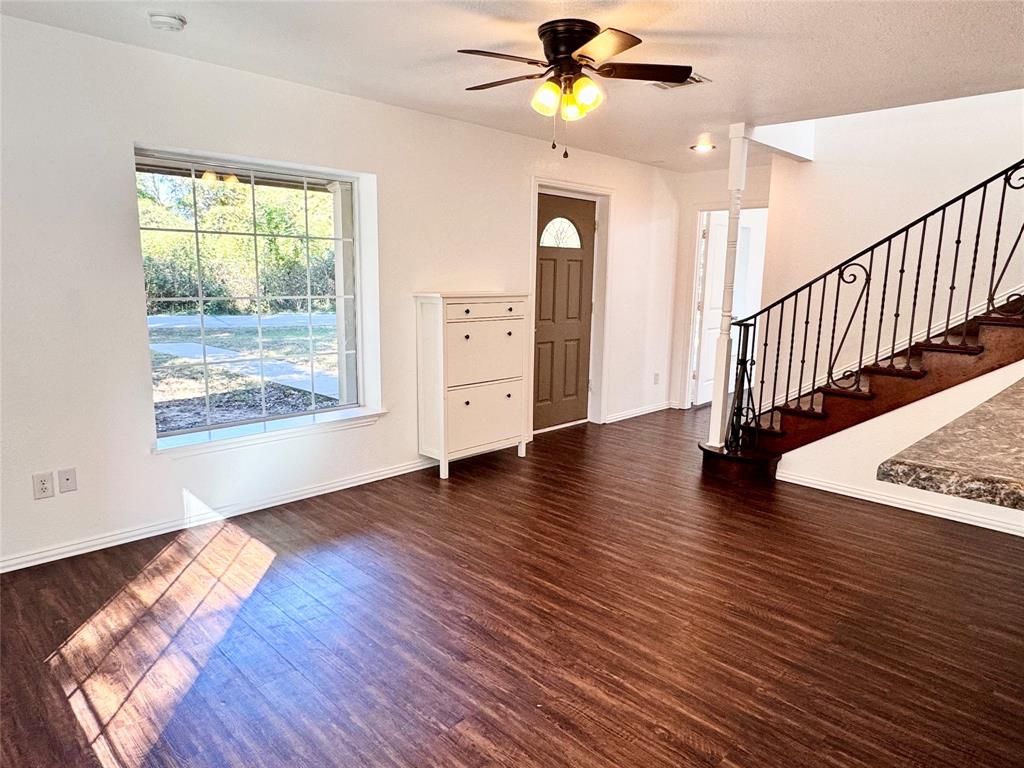 921 Bradleys Bend Tool, TX 75143 - Photo 4 of 29 a view of an empty room with wooden floor and a window