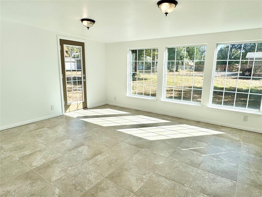 921 Bradleys Bend Tool, TX 75143 - Photo 8 of 29 a view of an empty room with a window
