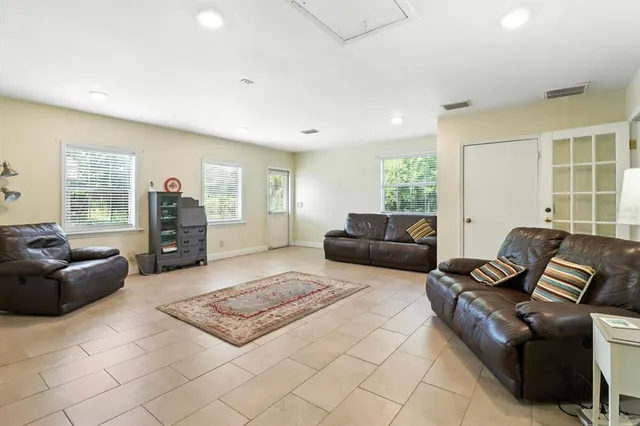 a living room with furniture and a window