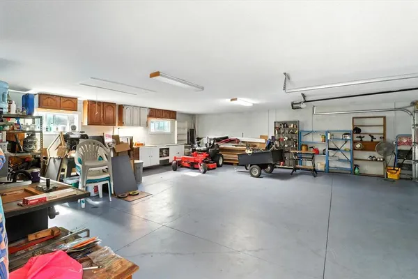 a view of a livingroom with furniture and a garage